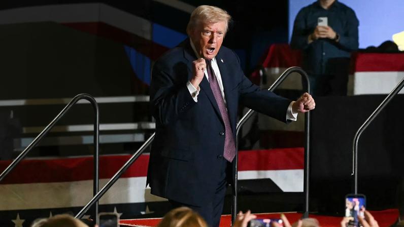 US President Donald Trump dances after speaking at a political rally in Rocky Mount, North Carolina on December 19, 2025.