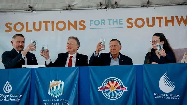 From left, Dan Denham of the San Diego County Water Authority; Scott Cameron of the U.S. Bureau of Reclamation; Tom Buschatzke of the Arizona Department of Water Resources; and Colby Pellegrino of the Southern Nevada Water Authority toasted the agreement at the Carlsbad Desalination Plant in California on Wednesday.