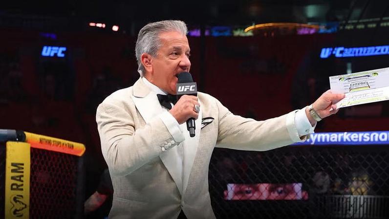 Octagon announcer Bruce Buffer introduces a fighter during the UFC 327 event at Kaseya Center