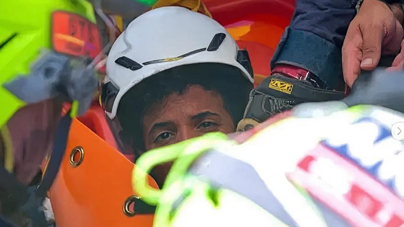 An 11-year-old boy, named Moises, was rescued after days trapped beneath heavy rubble