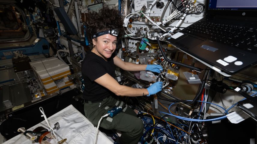Astronaut Jessica Meir inspects optical fibers while installing hardware updates to NASA’s Cold Atom Lab, or CAL, aboard the International Space Station on May 8, 2026. About the size of a minifridge, CAL enables researchers to explore quantum physics.
