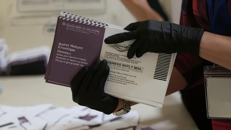 Department of Elections workers sort mail-in ballots for the California primary election at City Hall in San Francisco, Calif., earlier this month.