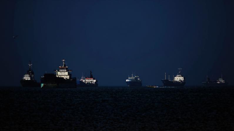 Commercial ships at anchor in the Strait of Hormuz.
