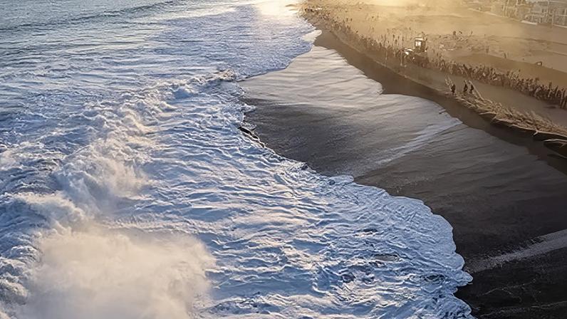 Spectators gather at the Wedge, a famed surf break, during a powerful south swell on 9 June 2026 in Newport Beach, California.