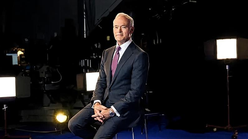 Getty Images Scott Pelley sits in a chair posing for a portrait