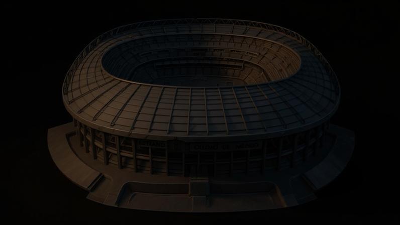 O cartum mostra na parte superior do desenho uma ilustração detalhada do Estádio Azteca, na Cidade do México, representado como uma imagem técnica ou arquitetônica. O estádio ocupa o centro da composição. Na parte inferior, aparecem quatro cães observadores. O primeiro, um vira-lata, informa: “Esse é o Azteca, no México, estádio da abertura da Copa de 2026!” Uma cadela Yorkshire Terrier pergunta: “Estadistas de todo o mundo irão comparecer à cerimônia?” Um cão salsicha responde: “Quase nenhum! Estão em falta...” Um cão fila brasileiro comenta: “Principalmente naquele país vizinho!”