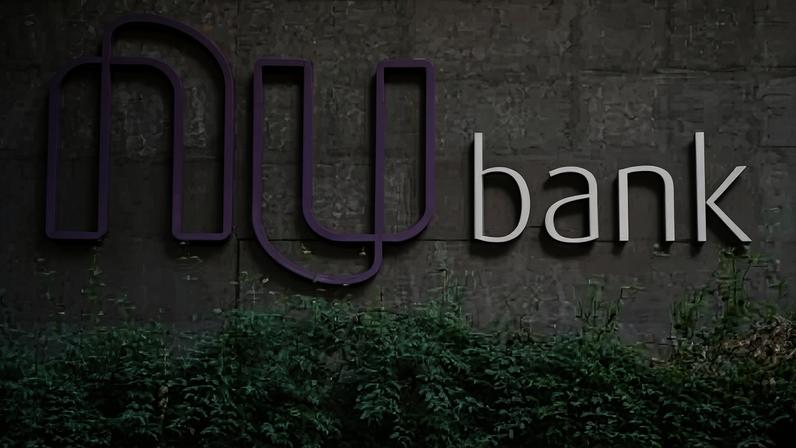 View of the logo of Brazilian FinTech startup Nubank outside its headquarters, in Sao Paulo, Brazil, on June 9, 2021. Nubank announced on June 8, 2021 that the investment company of US magnate Warren Buffett, Berkshire Hathaway Inc (BRKa.N), has bought a 500 million dollar stake in the digital bank, capital that will be invested in its expansion. / AFP / NELSON ALMEIDA