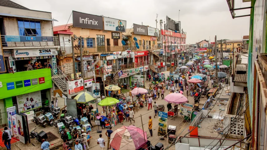 Crowds of shoppers walk through the Ikeja computer village market in Lagos.