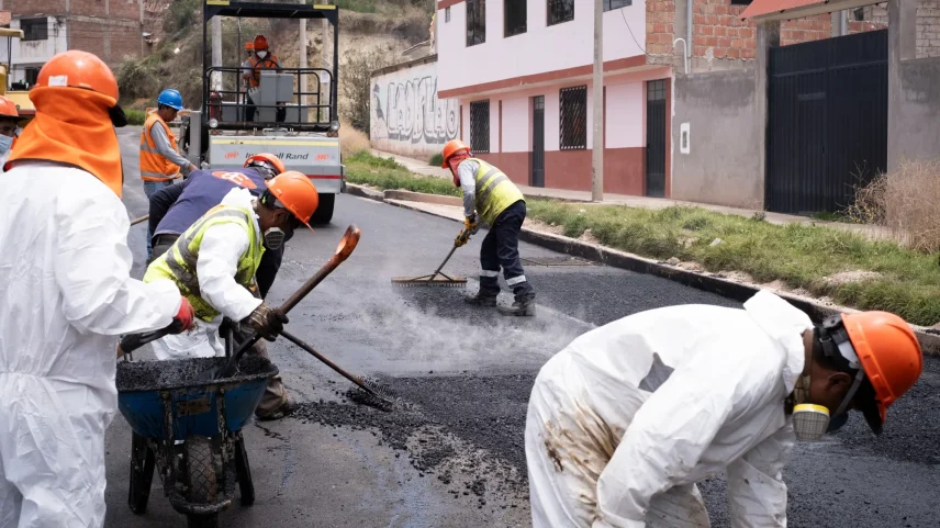 Construction workers pave a road in Cusco, Peru.