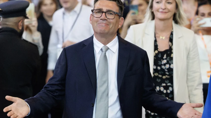 Andy Burnham celebrates after his swearing-in at the Houses of Parliament in London on June 22.