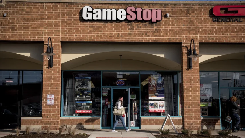A pedestrian walks past a GameStop Corp. store in Chicago.