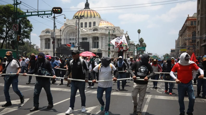 Demonstrators take part in a protest by CNTE teachers in Mexico City on June 1.