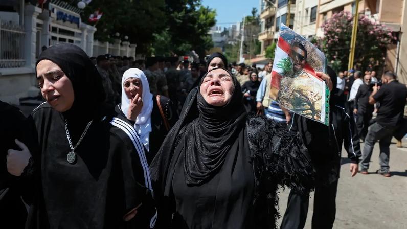A mourner reacts during the funeral of Brigadier General Wissam Sabra, who was killed in an Israeli strike targeting their military vehicle on the Khardali-Nabatieh road in south Lebanon on Saturday, in Beirut, Lebanon June 7, 2026. REUTERS/Mohamed Azakir