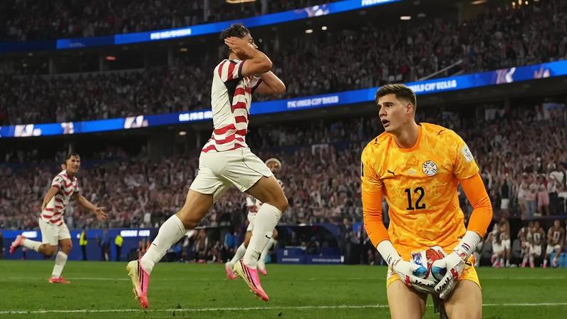 Giovanni Reyna of the U.S. celebrates scoring their fourth goal as Paraguay's Orlando Gill looks dejected IMAGN IMAGES via Reuters/Kirby Lee