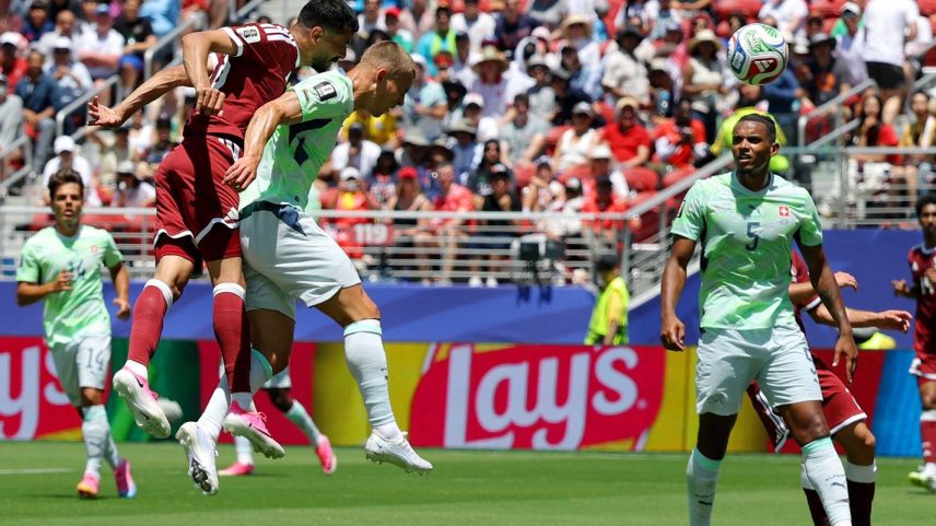 Qatar's Boualem Khoukhi scores their first goal