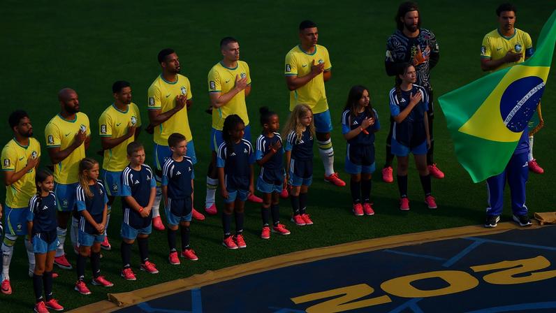 Brazil players line up during the national anthem before the match REUTERS/Mike Segar