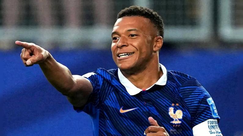 Mbappe celebrates scoring against Iraq in the group stage
