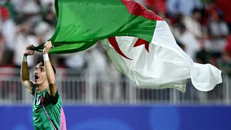 Adil Boulbina celebrates after the match as Algeria qualify for the knockout stages of the World Cup