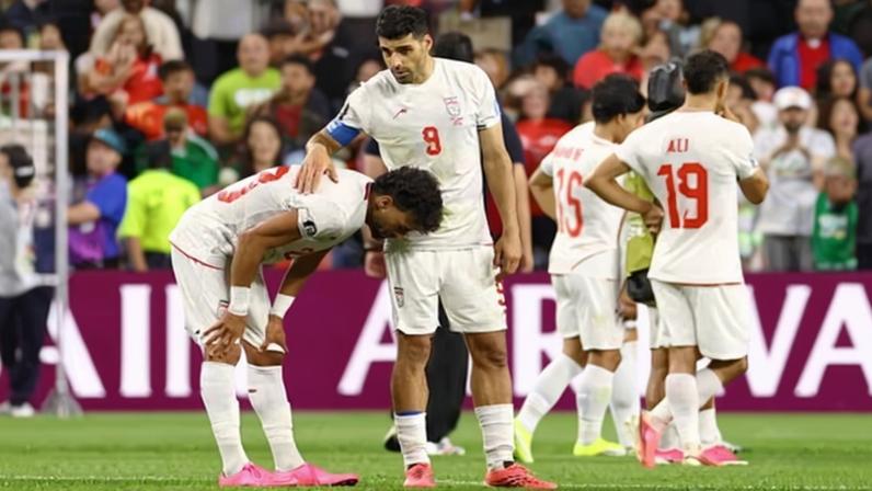 Iran's Ramin Rezaeian and Mehdi Taremi look dejected after the World Cup Group G game against Egypt in Seattle.