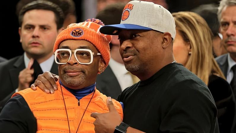 Chuck D attends a Knicks game in 2014 with Spike Lee.
