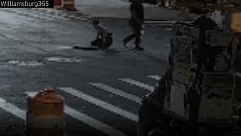 People emerge from a manhole in New York.