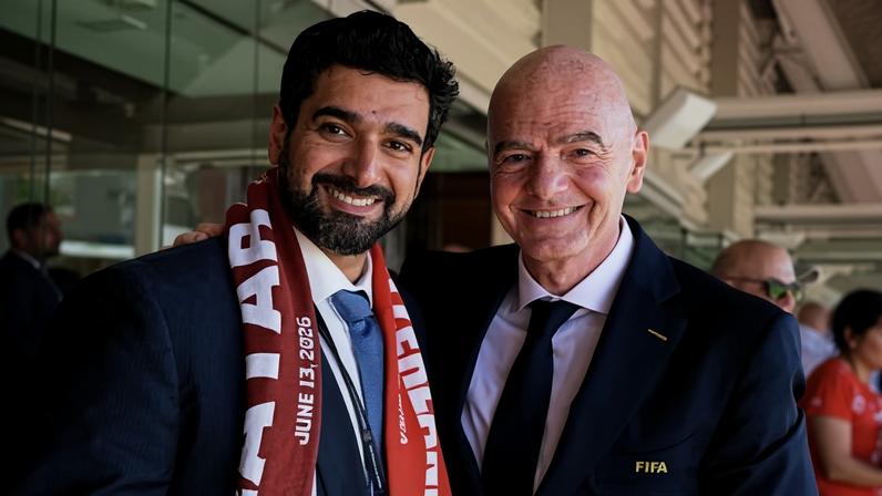 Gianni Infantino poses with the Qatar FA general secretary, Mansoor Mohammed Al-Ansari.