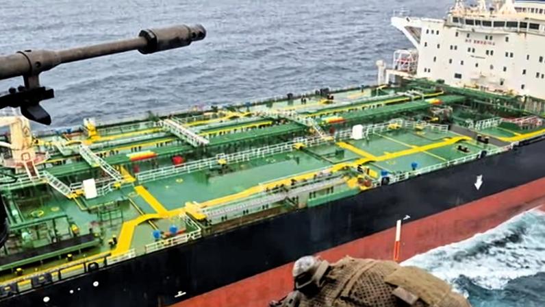 French navy personnel approaching the oil tanker.