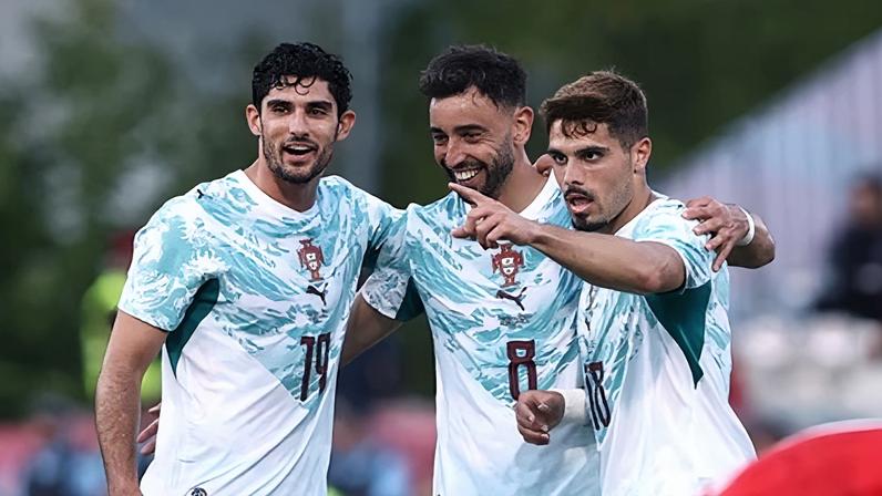 Portugal’s Bruno Fernandes celebrates with Gonçalo Guedes and Pedro Neto after a goal against Chile in a pre-World Cup friendly. Photograph: Rodrigo Antunes/Reuters