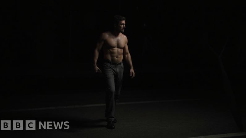 Topless man with knife with face blurred