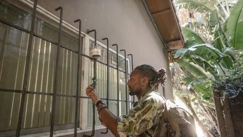 Shance Taylor makes adjustments to an air sensor in Pacoima, California, on 17 March 2026.