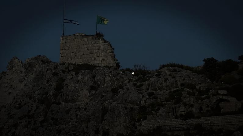 An Israeli flag and a flag of the Golani Brigade fly on Beaufort Castle.