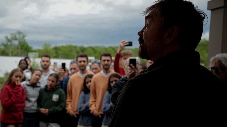 Democratic candidate for US Senate Graham Platner talks to the crowd outside his campaign town hall meeting in Portland, Maine.