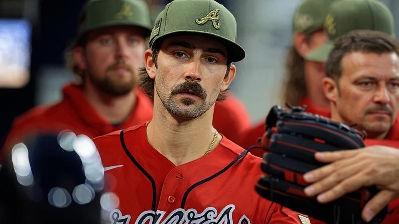 Spencer Strider looks forward in the dugout during an Atlanta Braves game.