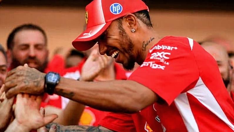 Lewis Hamilton is greeted by his jubilant Scuderia Ferrari team after winning the Barcelona-Catalunya Grand Prix.