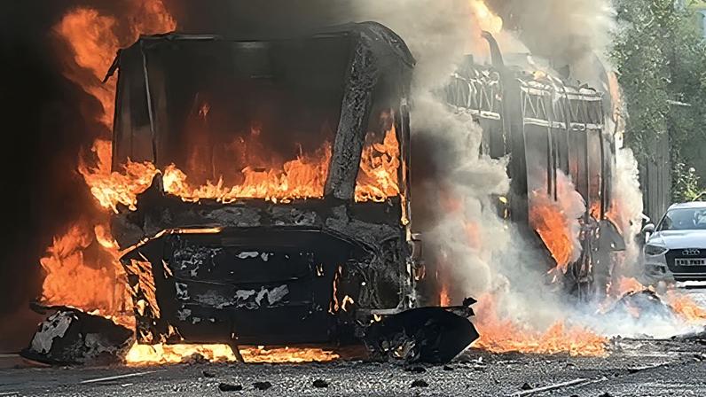 Bus and cars burned in anti-immigration protests in Belfast after stabbing – video