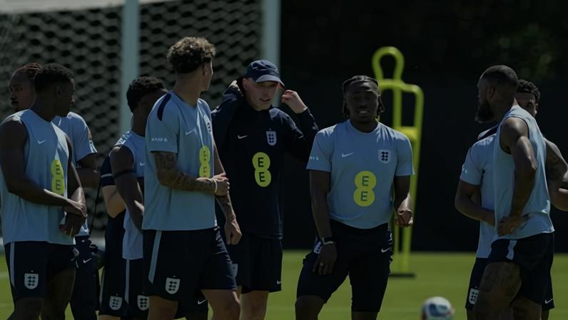 England's German head coach Thomas Tuchel speaks with players during a training session at Swope Soccer Village in Kansas city