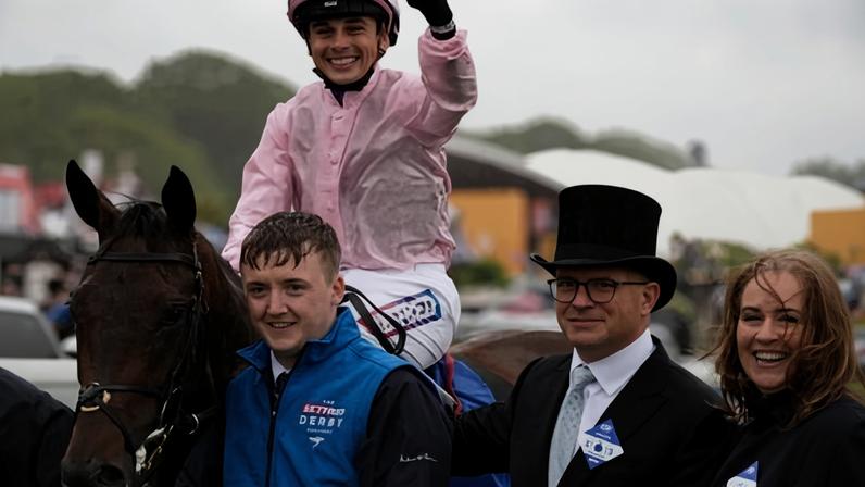 Jockey Ronan Whelan celebrates after winning the Derby aboard Christmas Day.