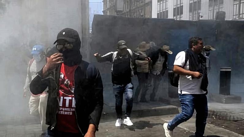 Teachers stand near a barricade blocking access to the Zocalo during a protest ahead of the World Cup 2026, in Mexico City on Monday.