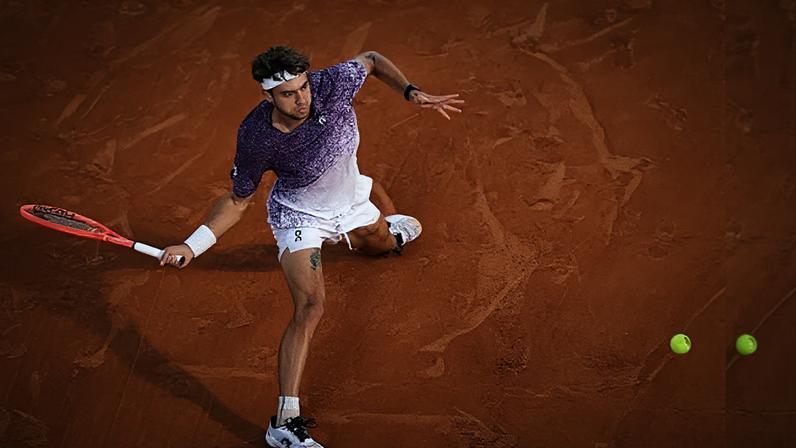 Flavio Cobolli plays a forehand against Félix Auger-Aliassime in his four-set win.