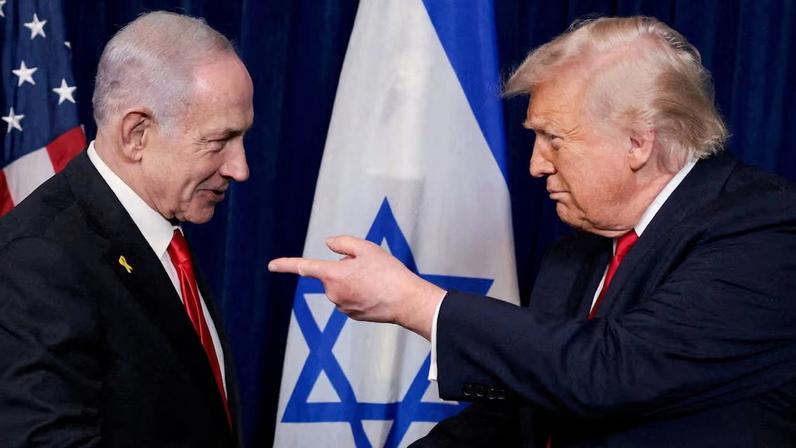 FILE PHOTO: U.S. President Donald Trump points his finger towards Israeli Prime Minister Benjamin Netanyahu as they shake hands during a press conference after meeting at Trump’s Mar-a-Lago club in Palm Beach, Florida, U.S., December 29, 2025. REUTERS/Jonathan Ernst/File Photo