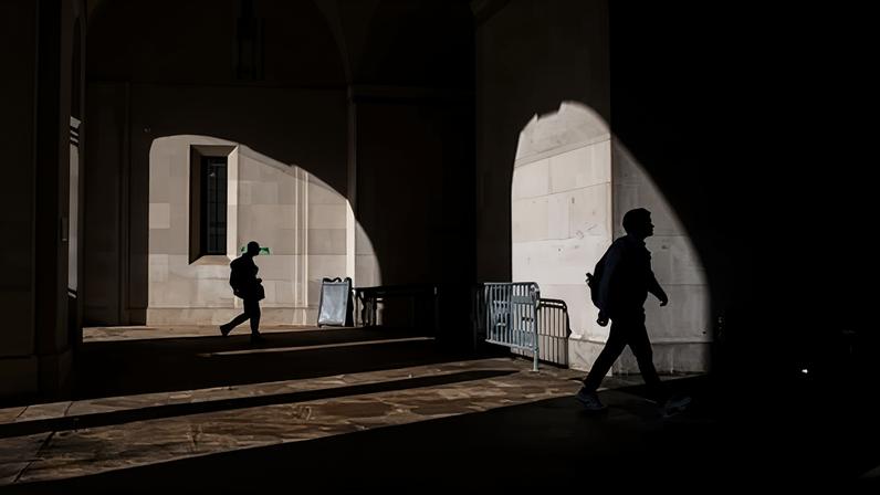 Commuters near the Federal Triangle metro station in Washington DC on 2 October 2025.