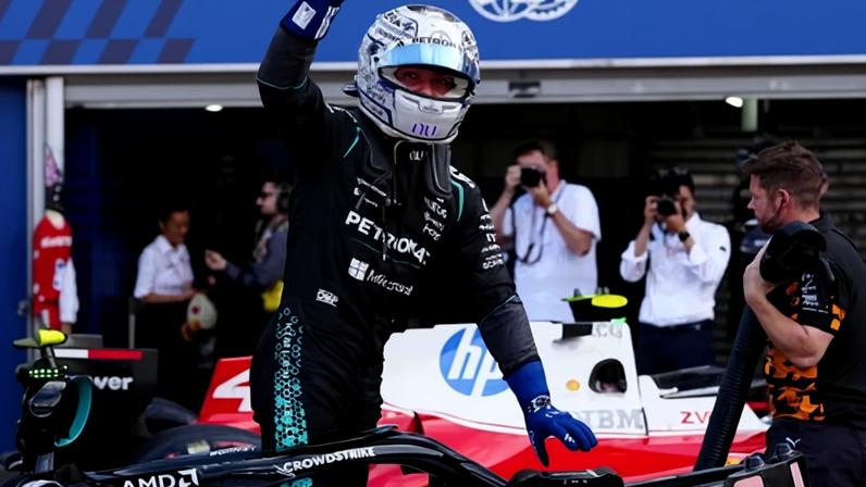 Kimi Antonelli waves to fans after taking pole position for the Monaco Grand Prix.