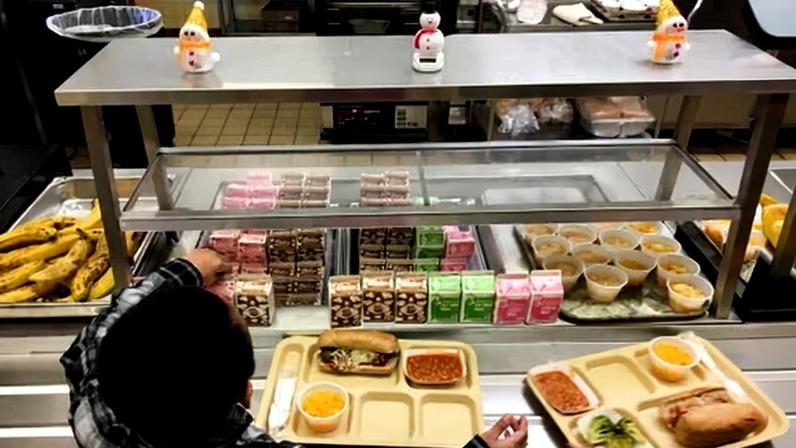 Students fill their lunch trays at the JFK elementary school in Kingston, New York, on 25 January 2017.