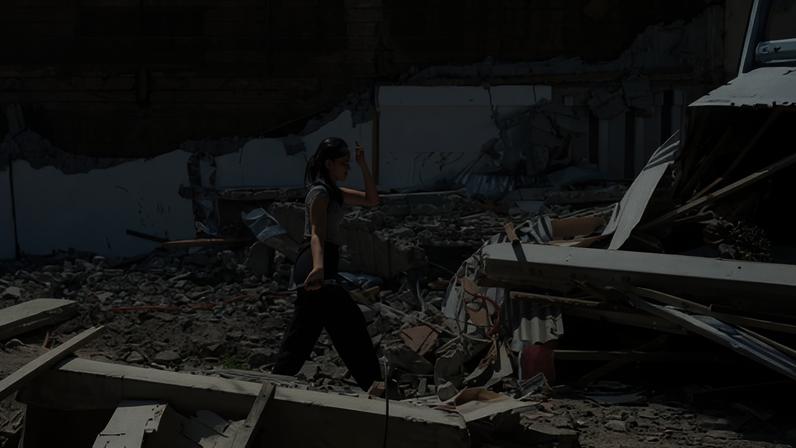 A girl searches for salvageable belongings in the debris of her collapsed home following a deadly earthquake in General Santos, Philippines, on 10 June, 2026.