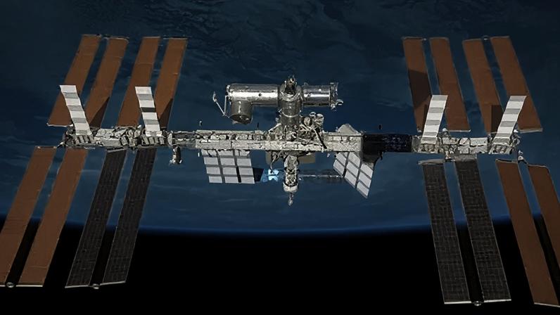Reuters The International Space Station is seen in the centre of the image in space orbiting the Earth