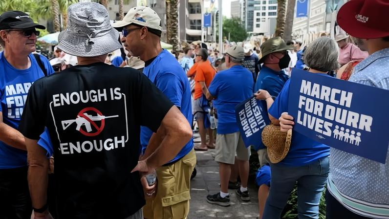 Gun safety advocates participate in the March For Our Lives rally in downtown Orlando, Florida, on 11 June 2022.