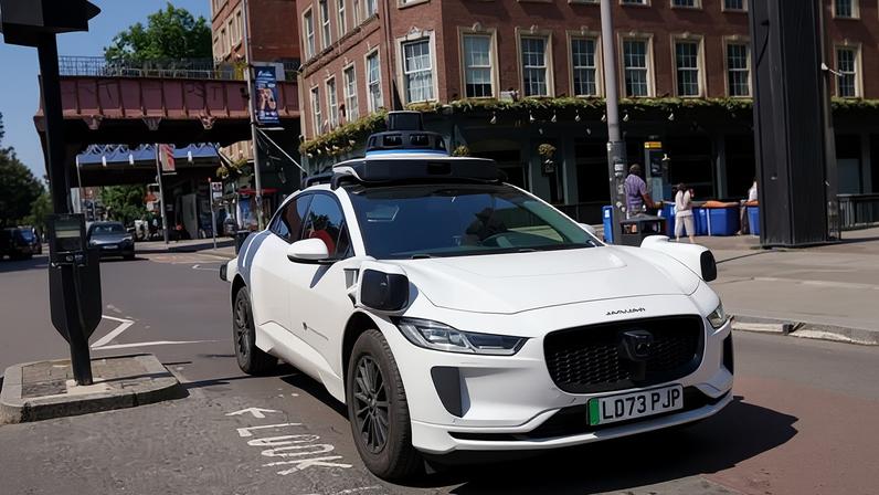 A Waymo taxi on the streets of London.