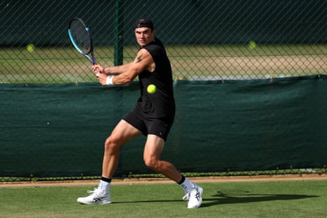 Jack Draper, wearing all black, prepares to play a backhand