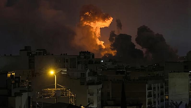 A large plume of smoke rises over Tehran after explosions were reported in the city during the night on 28 March 2026.