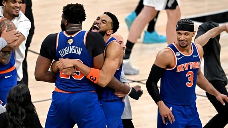 The New York Knicks celebrate after clinching the NBA title.